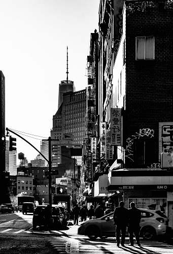 new york grayscale photo of high-rise buildings street photography